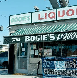 Boogie's Liquor store front with a green and white sign.